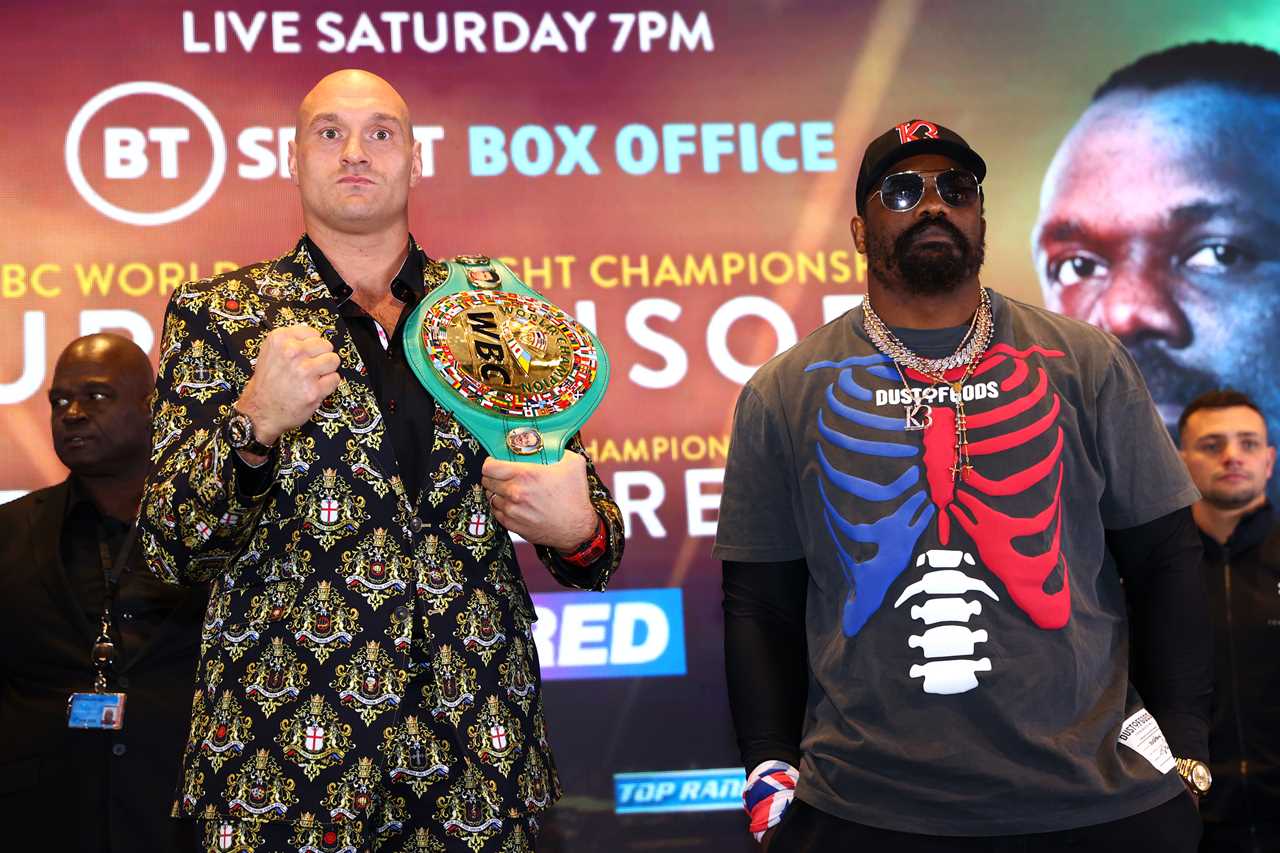 Tyson Fury shows off his amazing suit, which is emblazoned in LATIN with the family crest and there's only one Tyson Fury for Chisora bout