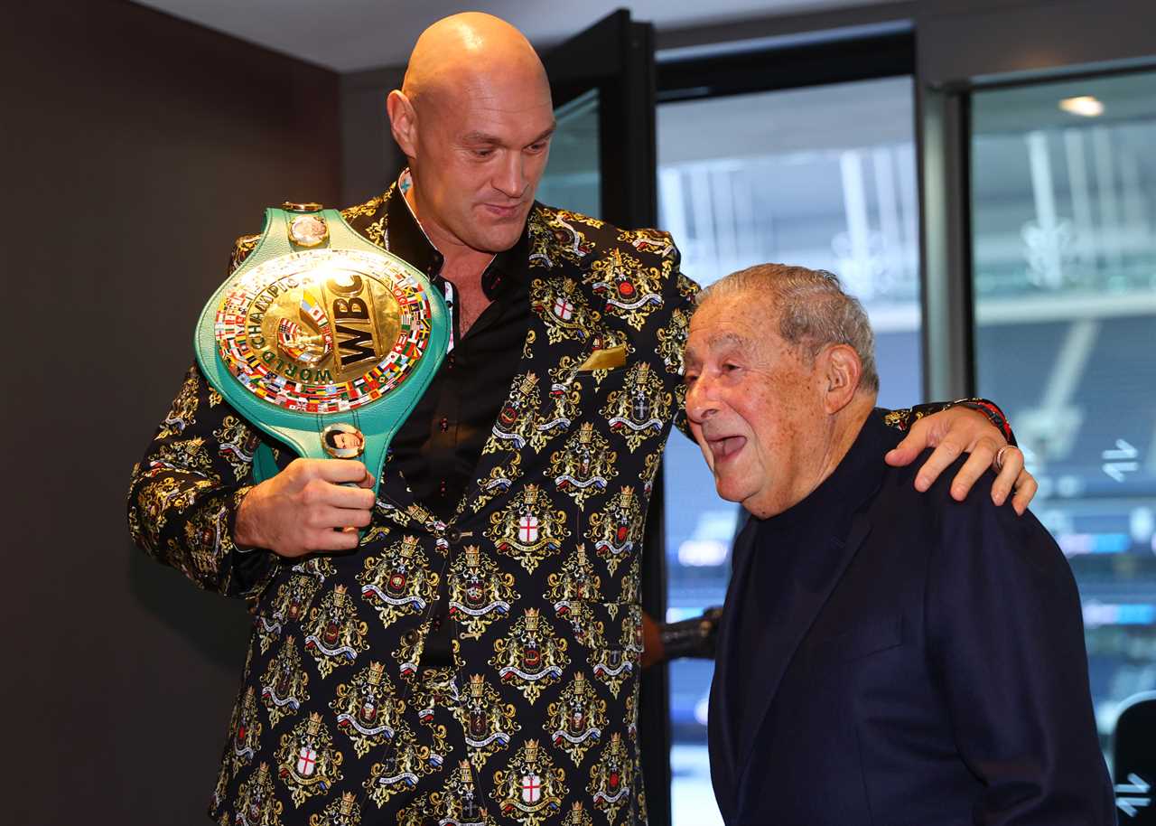 Tyson Fury shows off his amazing suit, which is emblazoned in LATIN with the family crest and there's only one Tyson Fury for Chisora bout