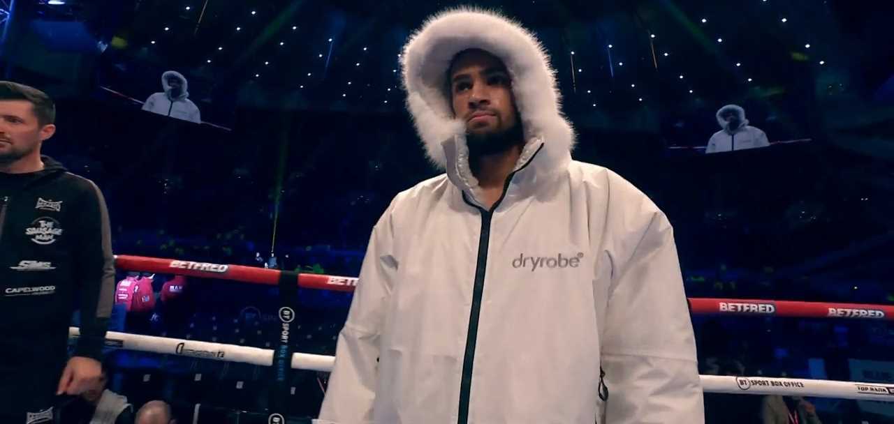 Itauma is wrapped up in a hooded jacket for the ring walk on Tyson Fury against Derek Chisora's undercard. This is to combat freezing temperatures