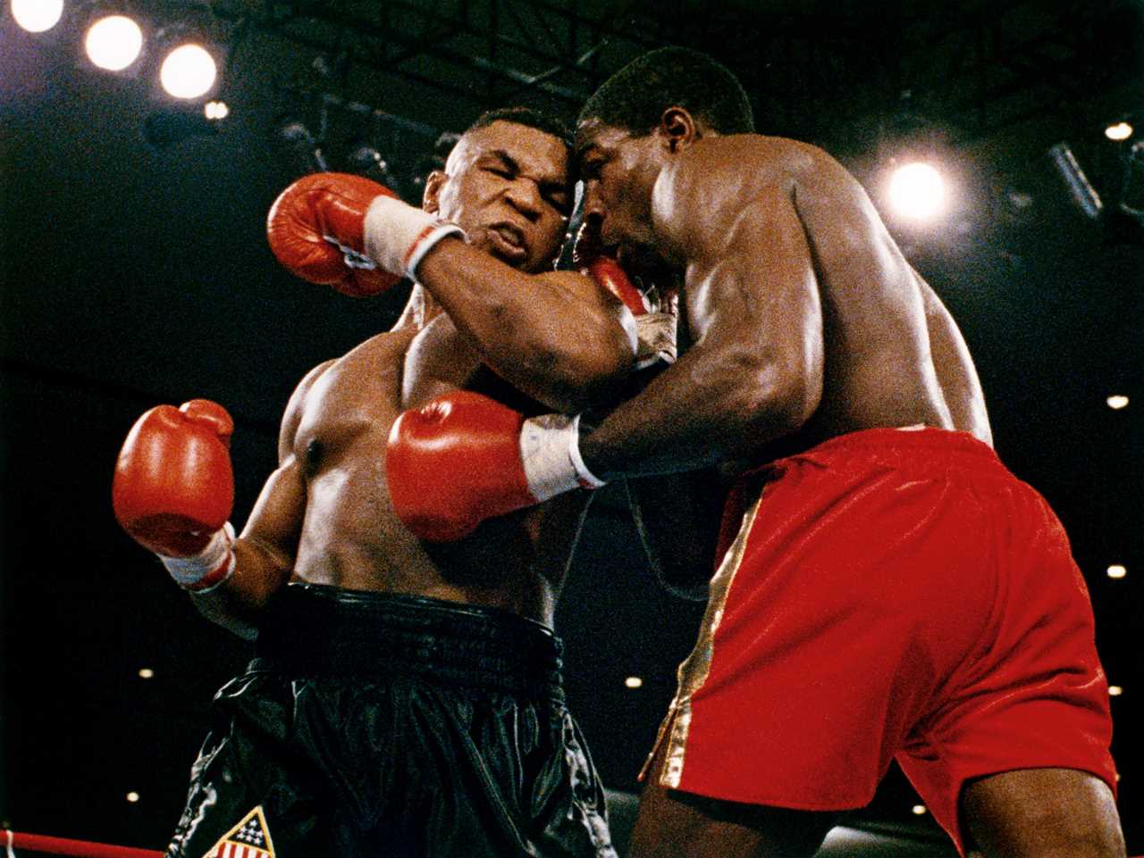 Tucker Carlson is watching stony-faced Mike Tyson making nervous laughter as he claims he 'wanted' to kill his opponents