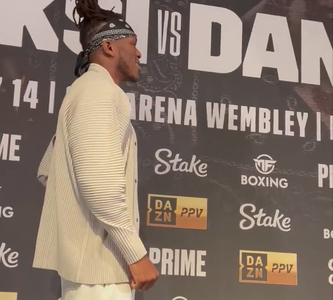 Watch KSI make an awkward grin as he faces off against NOBODY following Dillon Danis' non-show at the press conference