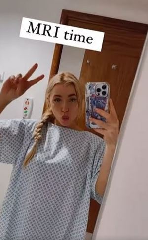 OnlyFans beauty and boxer Elle Brooke is pictured in a hospital gown in worrying Instagram photo