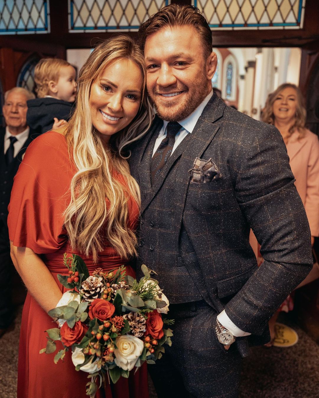 Conor McGregor, Dee Devlin and all smiles while they share a romantic moment to celebrate her sister's wedding.