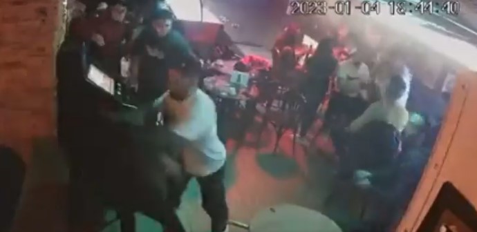 UFC star Ilia Topuria is allegedly involved in a bar brawl, as a man pushes him while he plays piano alongside Omar Montes, a Spanish singer