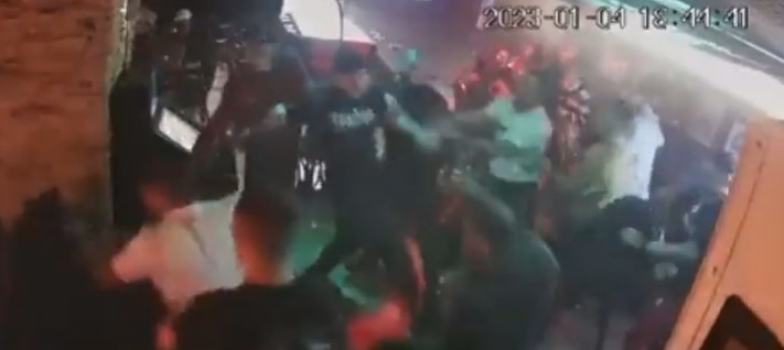 UFC star Ilia Topuria is allegedly involved in a bar brawl, as a man pushes him while he plays piano alongside Omar Montes, a Spanish singer