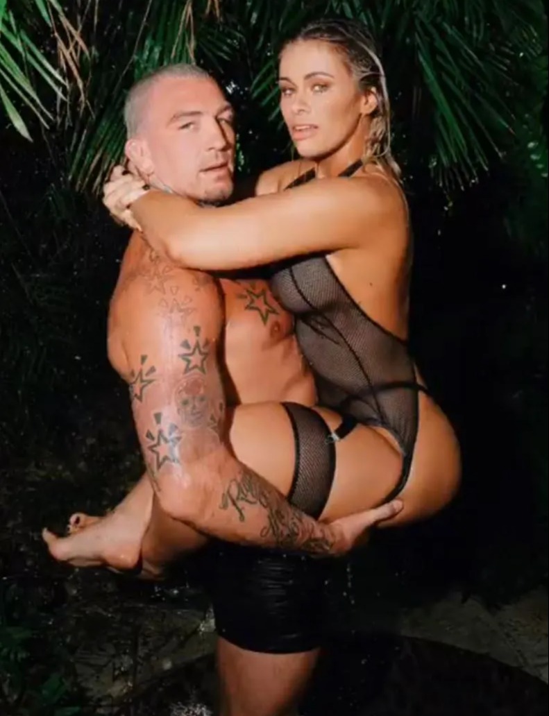 Paige VanZant and her husband pose in a VERY X-rated photo. The ex-UFC star is wearing sexy lingerie, bra, and black mesh clothing
