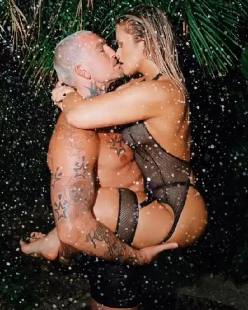Paige VanZant and her husband pose in a VERY X-rated photo. The ex-UFC star is wearing sexy lingerie, bra, and black mesh clothing