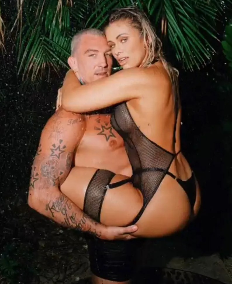 Paige VanZant and her husband pose in a VERY X-rated photo. The ex-UFC star is wearing sexy lingerie, bra, and black mesh clothing