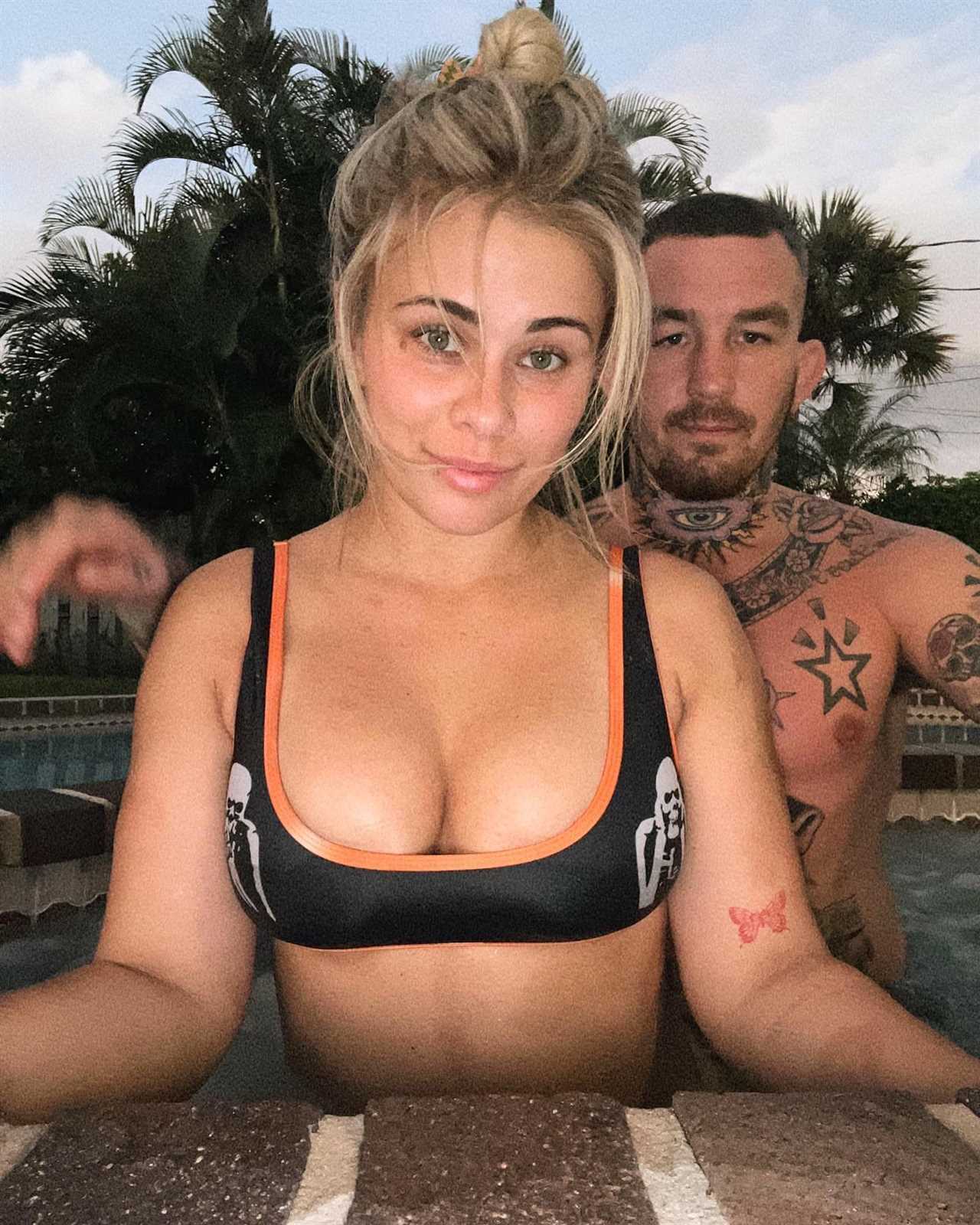 Paige VanZant and her husband pose in a VERY X-rated photo. The ex-UFC star is wearing sexy lingerie, bra, and black mesh clothing