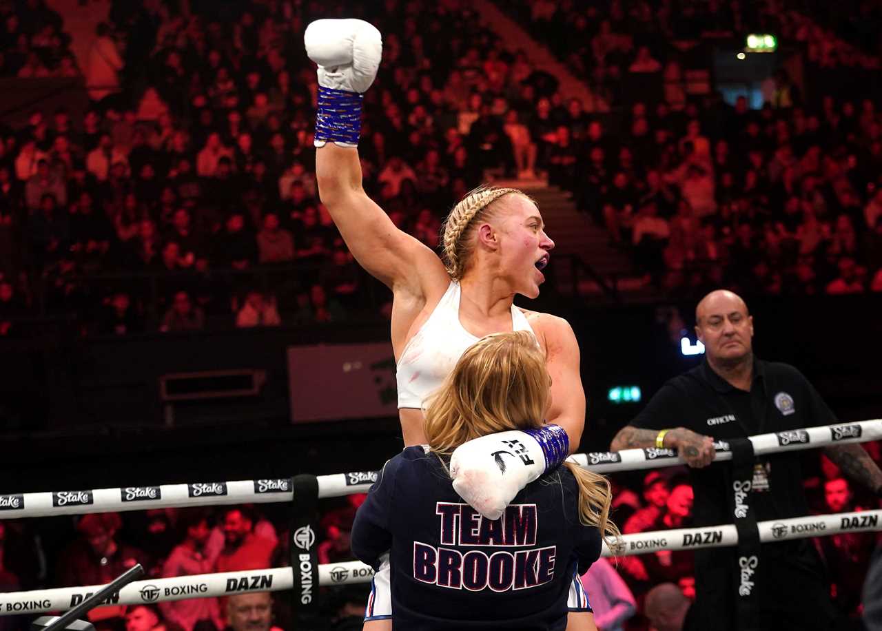 Elle Brooke celebrates her victory with Ebanie Bridges, OnlyFans' boxer turned friend.