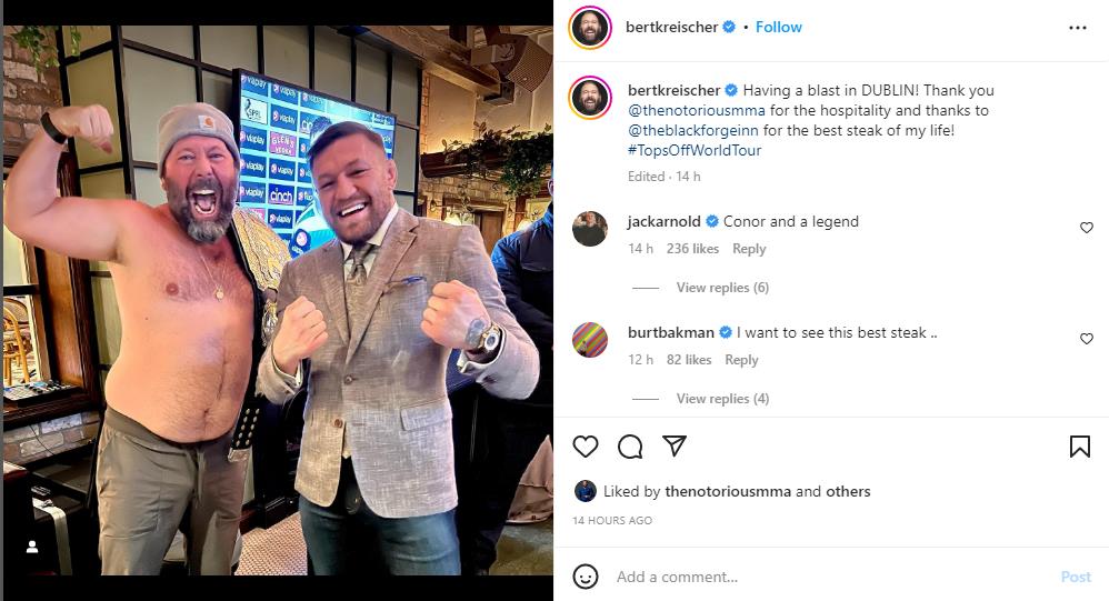 Conor McGregor smiles at Bert Kreischer, a topless American comedian, as he arrives at Black Forge Inn