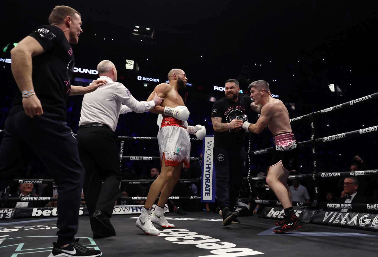 As Chris Eubank Jr was brutally knocked out, Liam Smith's coach held back Chris Eubank Jr.