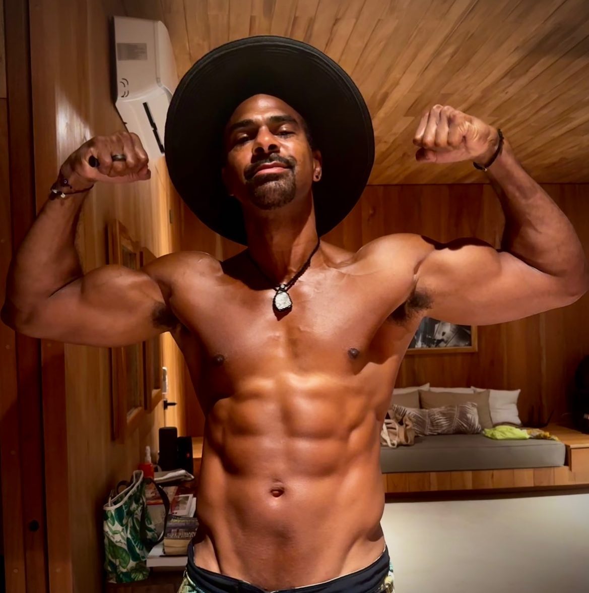 David Haye, 42 years old, displays a ripped body as the throuple-loving ex boxer enjoys hol time with Sian Williams