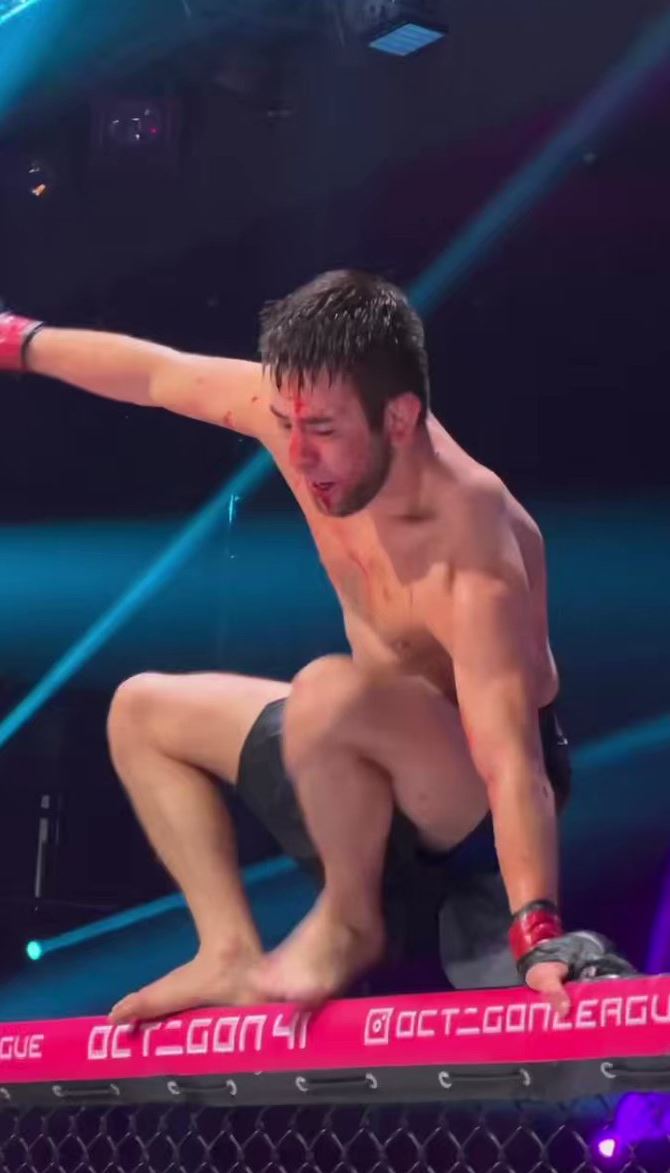 That would be me - Watch the incredible moment Teymur Zhaparov, MMA Fighter, falls off the top of his cage.