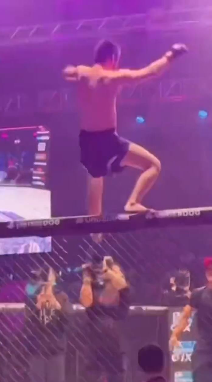 That would be me - Watch the incredible moment Teymur Zhaparov, MMA Fighter, falls off the top of his cage.
