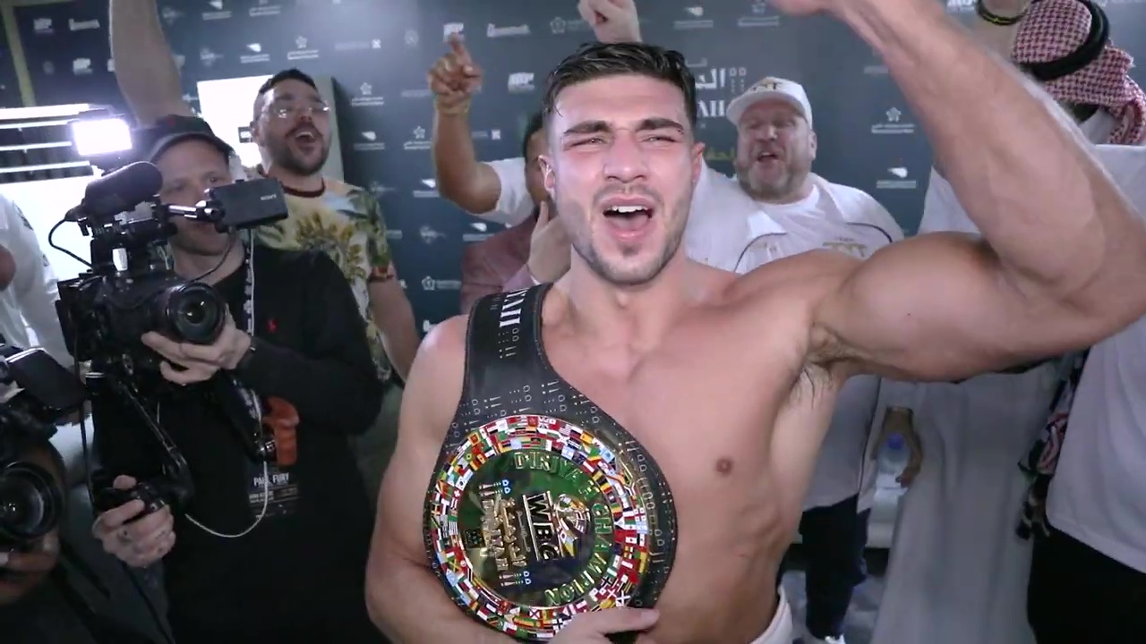 Tommy Fury's wild dressing-room celebrations after Jake Paul win, as Tyson leads chants.