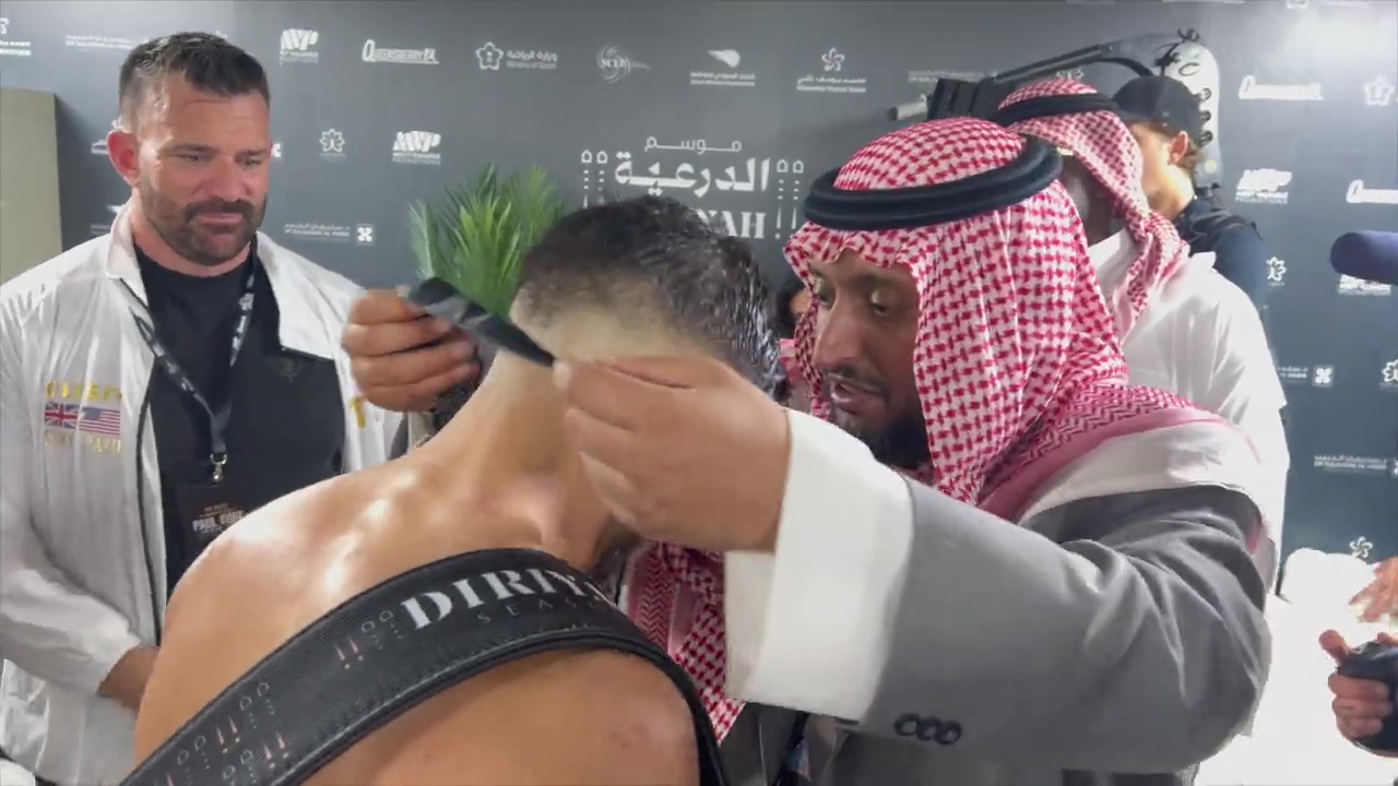 Tommy Fury's wild dressing-room celebrations after Jake Paul win, as Tyson leads chants.