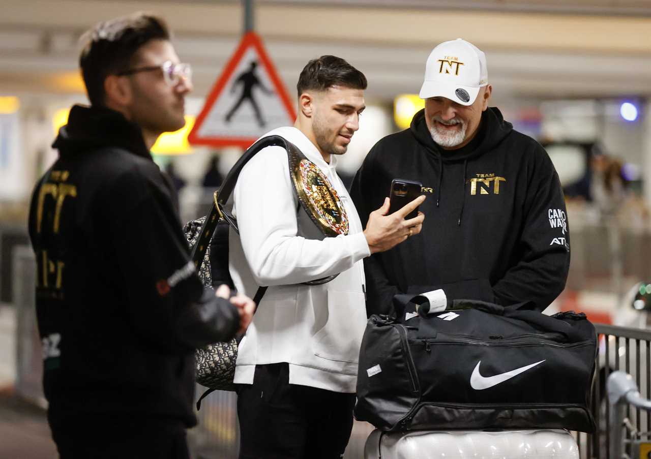 After a huge win over Jake Paul, Bruised Tommy Fury beams when he touches down at Heathrow together with dad John and brother Tyson.