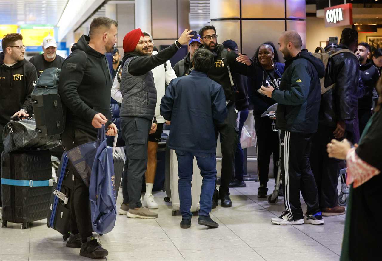 After a huge win over Jake Paul, Bruised Tommy Fury beams when he touches down at Heathrow together with dad John and brother Tyson.