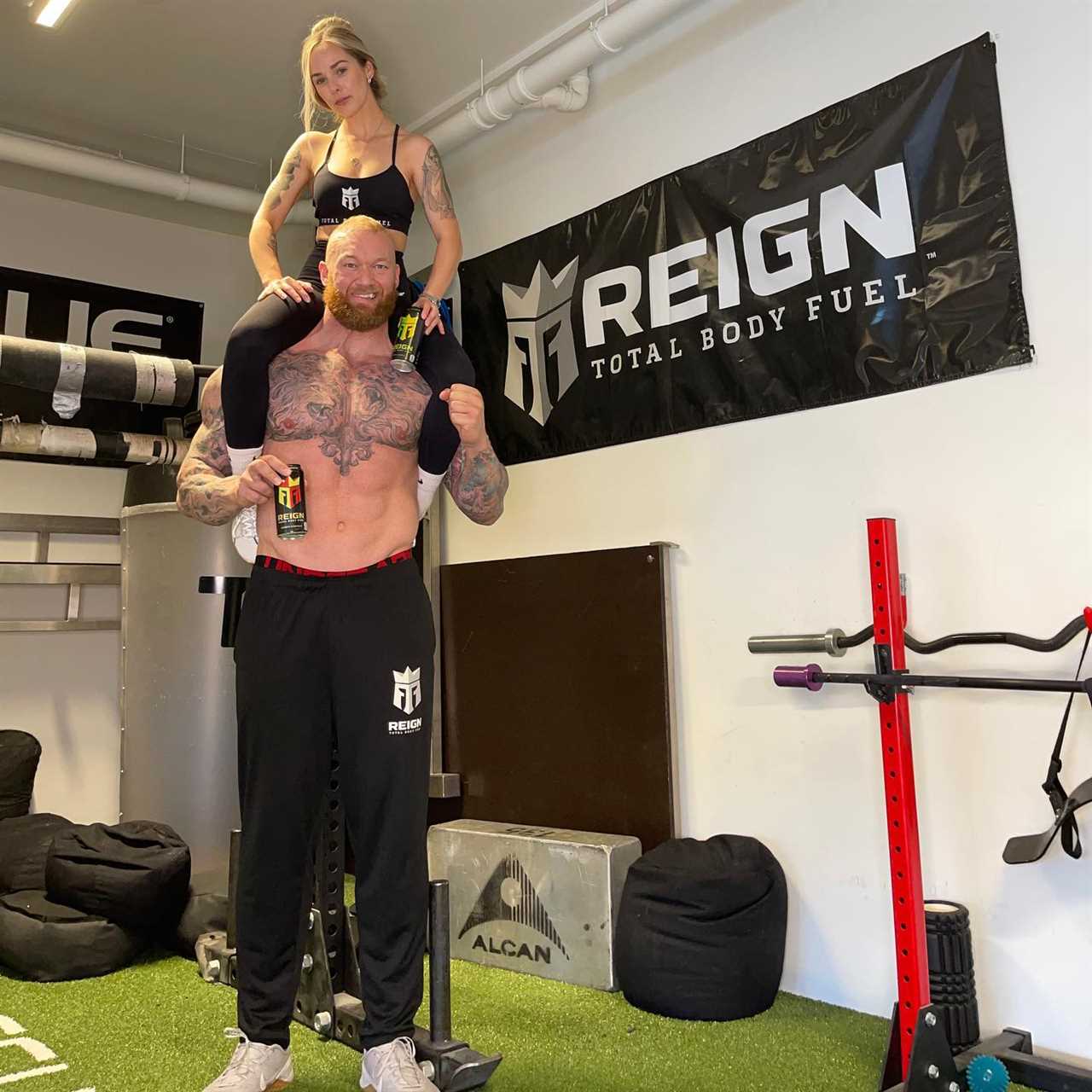 Watch Game of Thrones star Hafthor Bor Bjornsson's insane display of strength using his wife as a DUMBBELL