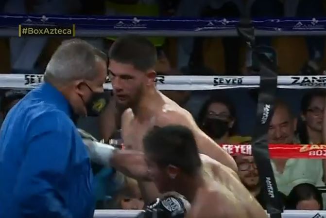 Turrubiartes missed his target and accidentally clocked the ref
