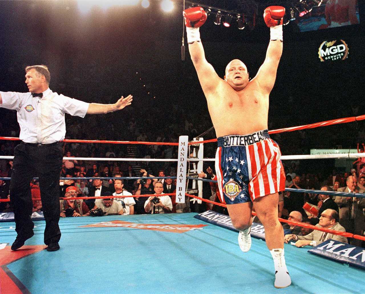 The boxing cult hero is unrecognizable in throwback snap, with long flowing hair and a cheeky smile while wearing dungarees