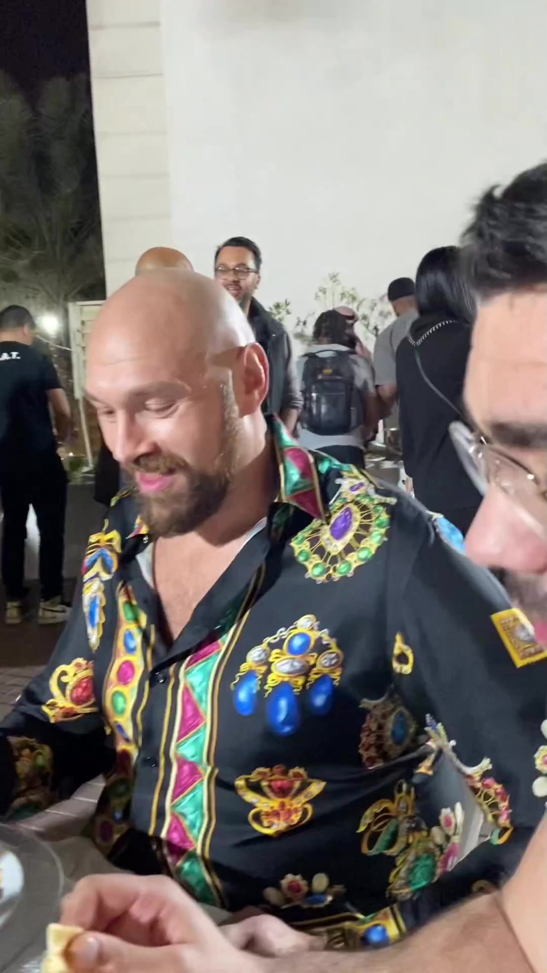 Tyson Fury and father John enjoy dinner with Mike Tyson and Michael Buffer at star-studded tables