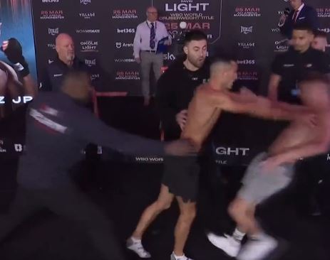 Boxer Michael Gomez Jr. sends his rival flying in a fiery weigh-in, as security forces intervene