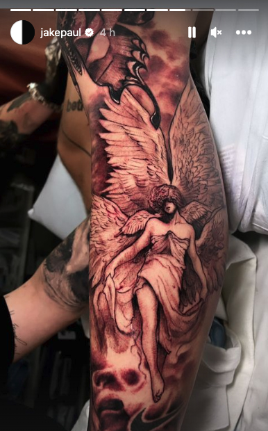 Jake Paul displays a brand new collection of tattoos, including a full leg sleeve featuring an angel and a massive tiger on the foot.