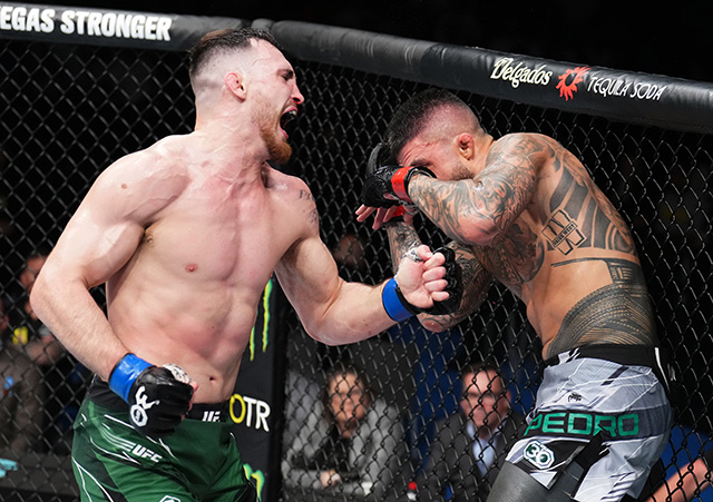 PERTH, AUSTRALIA - FEBRUARY 12: (L-R) Modestas Bukauskas of Lithuania punches Tyson Pedro of Australia in a light heavyweight fight during the UFC 284 event at RAC Arena on February 12, 2023 in Perth, Australia. (Photo by Chris Unger/Zuffa LLC via Getty Images)