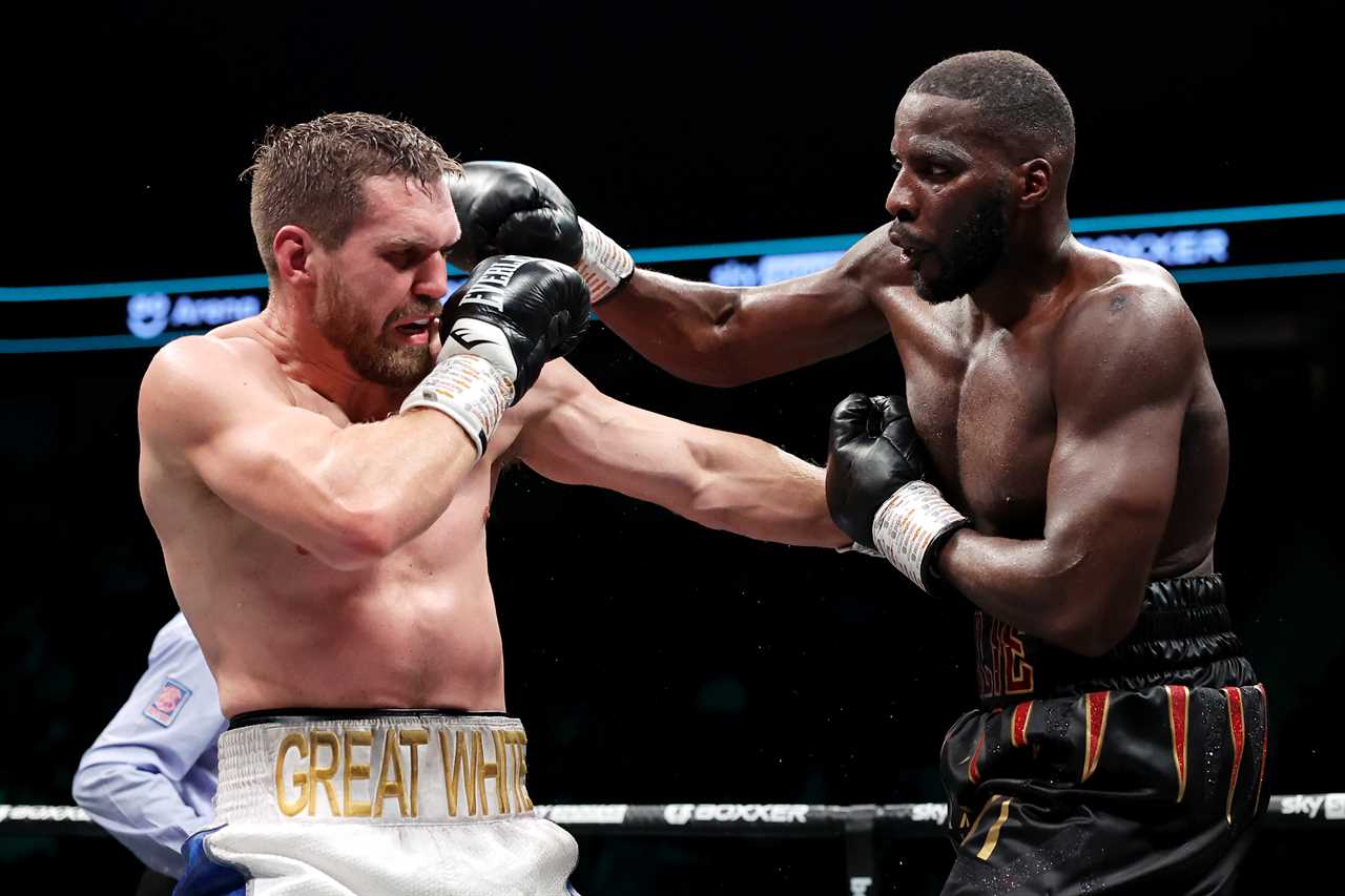 Television viewers see a singer reading the national anthem from her hand, before Lawrence Okolie's win for the'shambolic title'