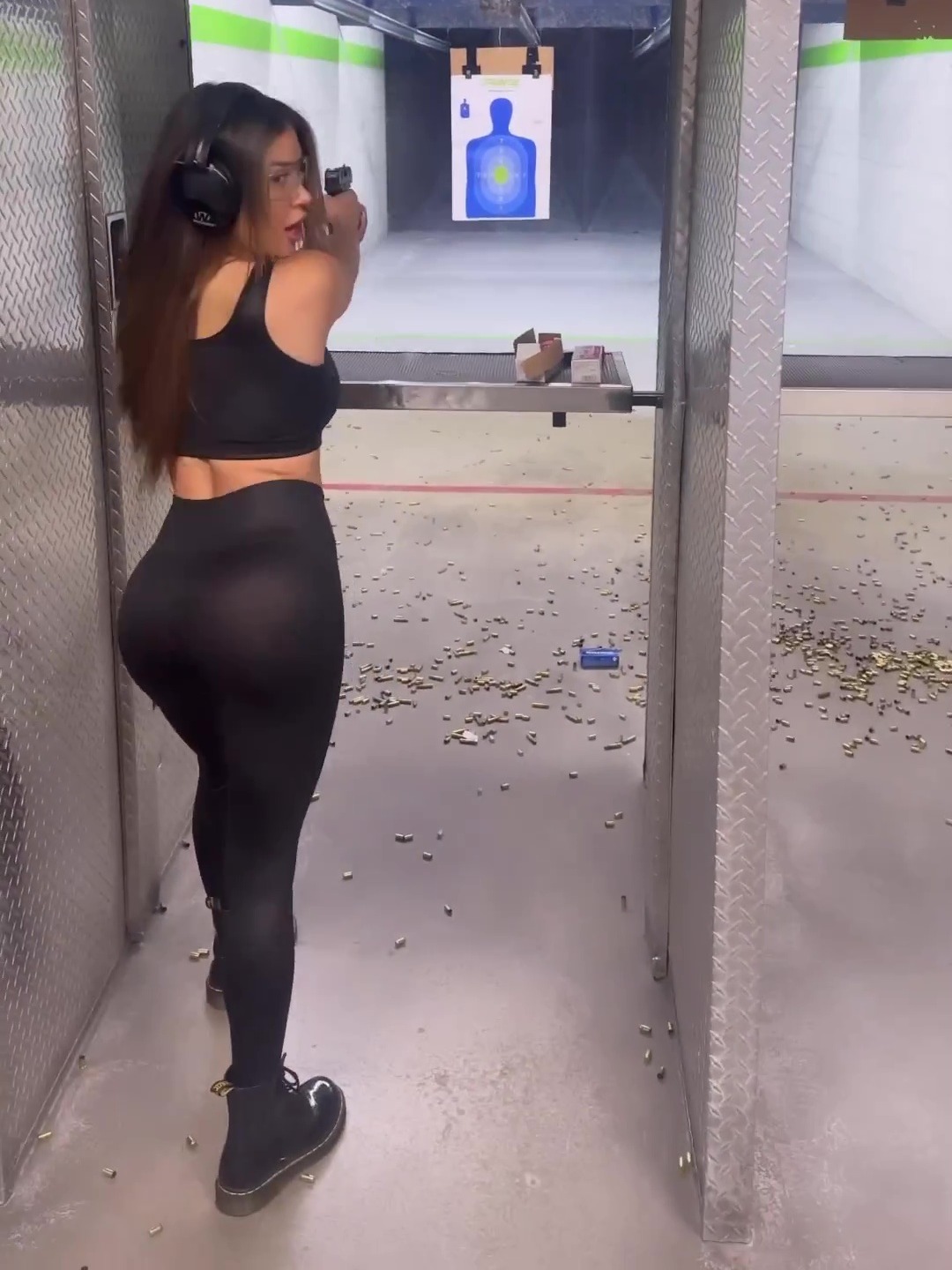 Arianny Celeste, a stunning UFC octagon girl shows off her bum at the shooting range in see-through leggings
