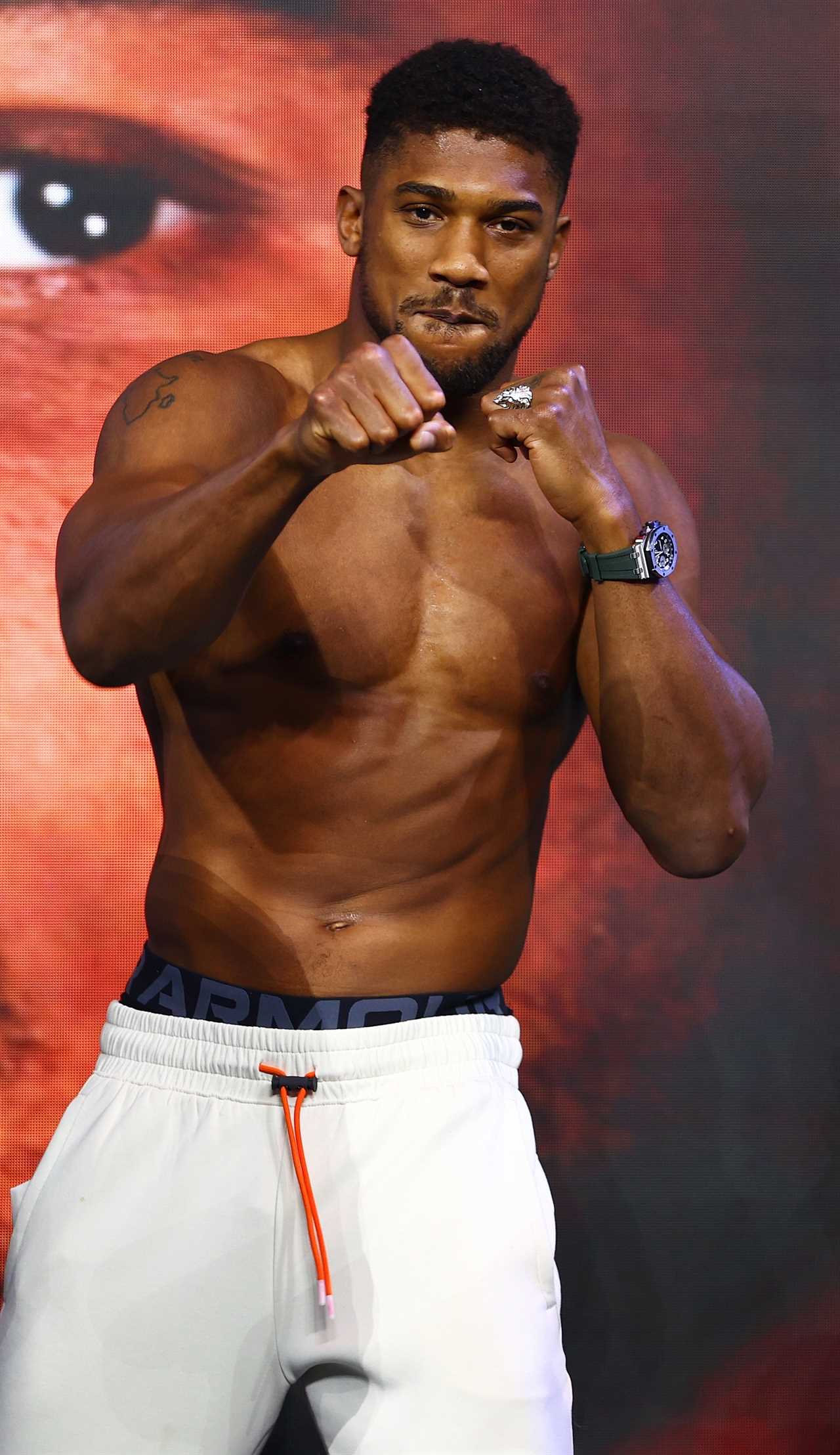 JEDDAH, SAUDI ARABIA - AUGUST 19: Anthony Joshua and their coach Robert Garcia react after the Weigh-In for Oleksandr Usyk v Anthony Joshua Rage on the Red Sea event at King Abdullah Sports City Arena on August 19, 2022 in Jeddah, Saudi Arabia. (Photo by Francois Nel/Getty Images)