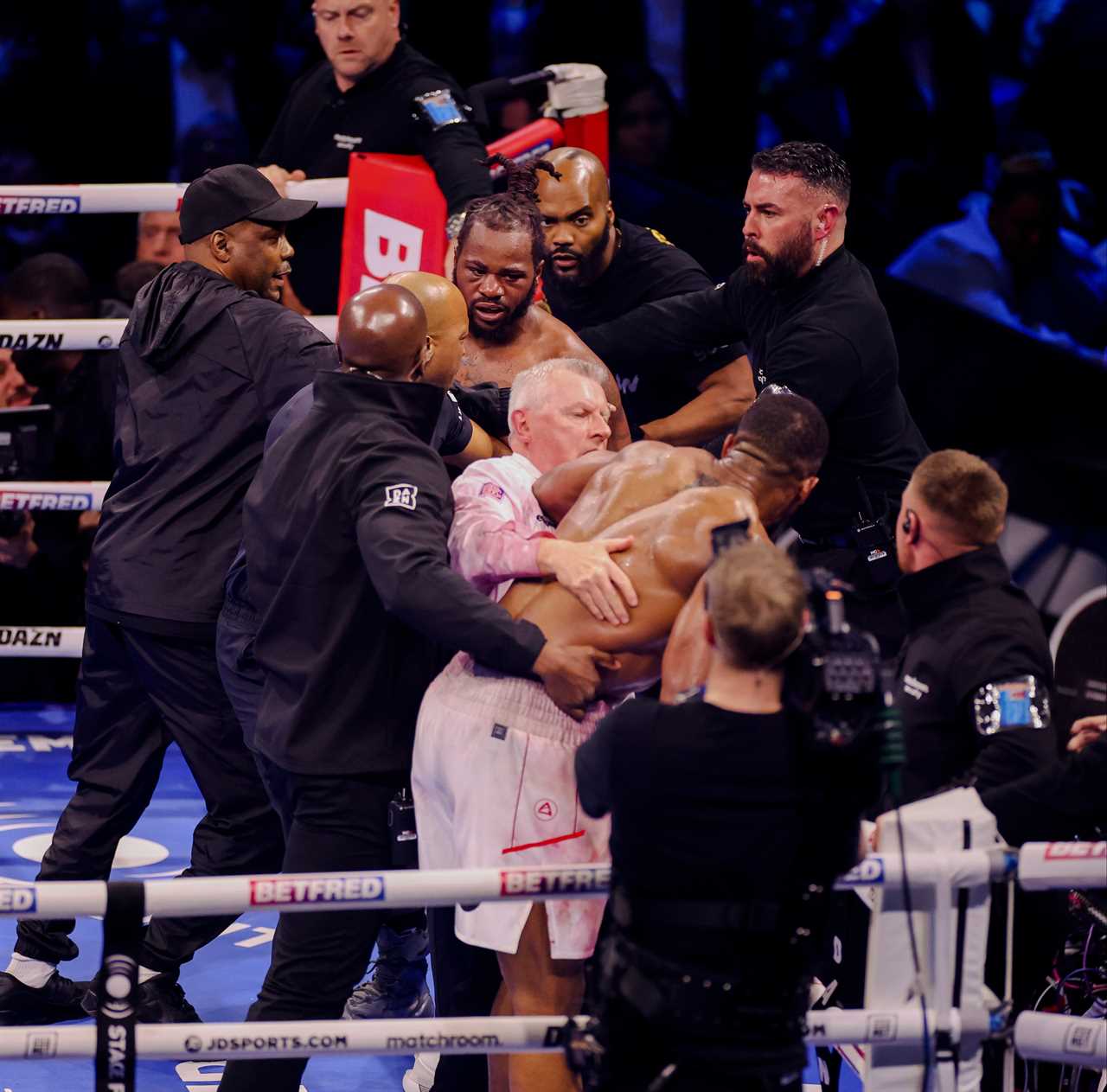 Chaos after Anthony Joshua and Jermaine Frank fight, as both boxers rage and must be separated by security