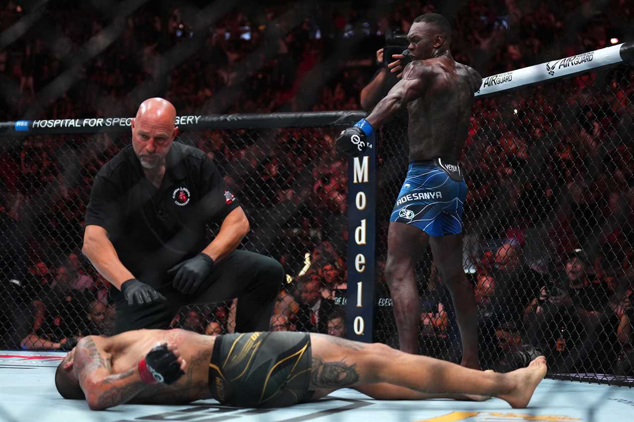 MIAMI, FLORIDA - APRIL 08: Israel Adesanya of Nigeria reacts after knocking out Alex Pereira of Brazil in the UFC middleweight championship fight during the UFC 287 event at Kaseya Center on April 08, 2023 in Miami, Florida. (Photo by Cooper Neill/Zuffa LLC via Getty Images)