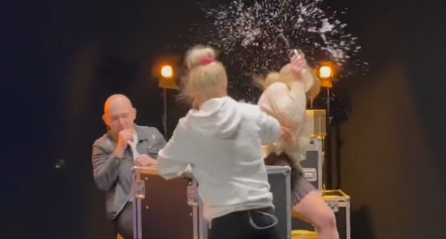 Elle Brooke's face-off with rival descends into chaos as she is dragged to the floor and kicked after throwing a glass of water at her opponent's face