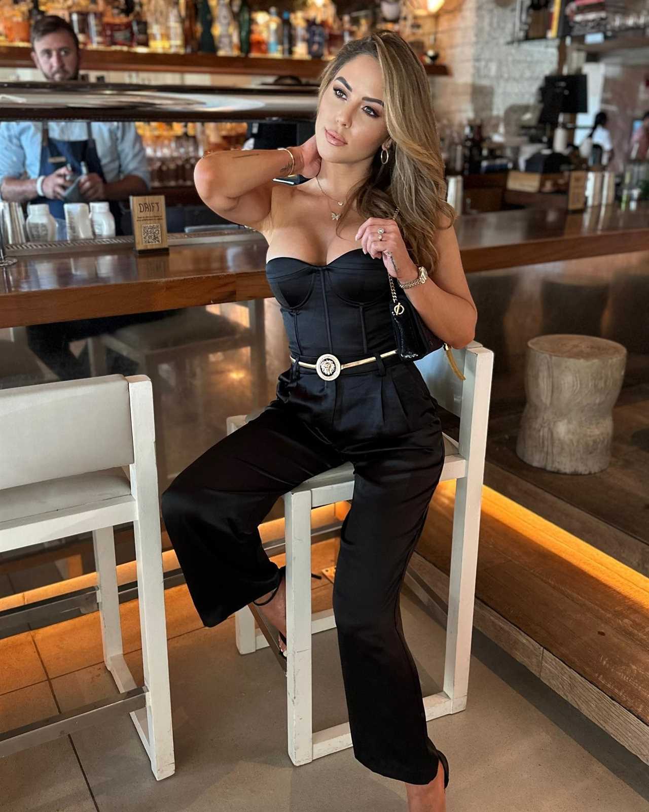 Brittney Palmer, the UFC octagon girls, puts on a busty show in her body-hugging workout gear.