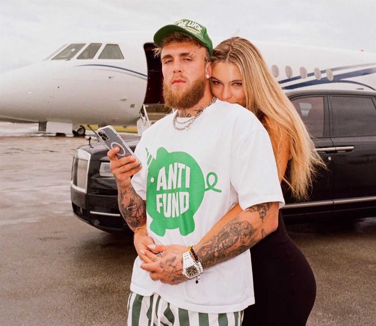 Jake Paul poses with the world's most beautiful speed skater and his pet dog outside his private jet.