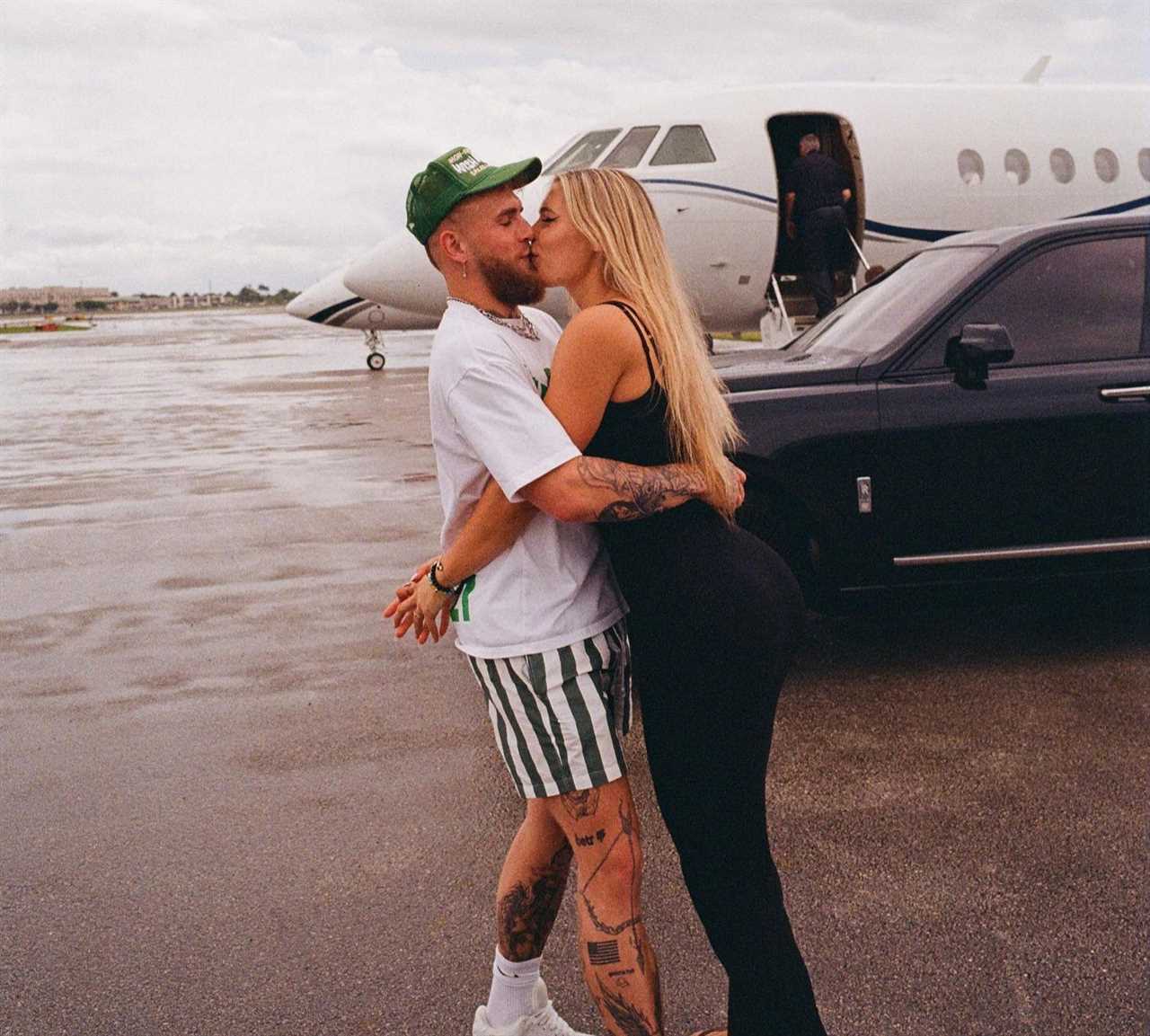 Jake Paul poses with the world's most beautiful speed skater and his pet dog outside his private jet.