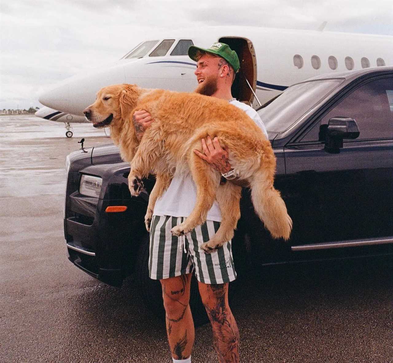 Jake Paul poses with the world's most beautiful speed skater and his pet dog outside his private jet.
