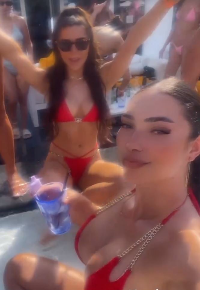 At a pool party in Dubai, a stunning Anthony Joshua ringgirl shows off her barely-there bikini.
