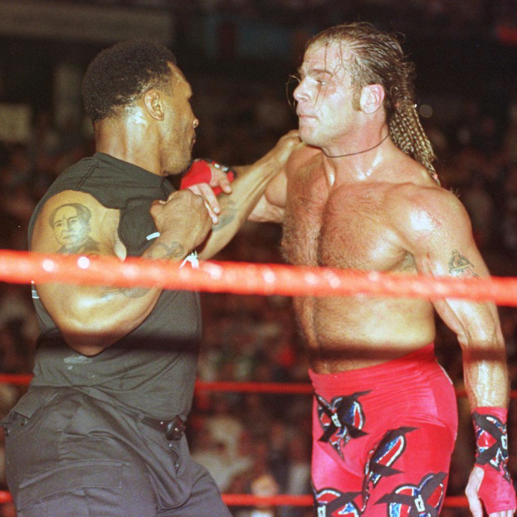 Mike Tyson, 56 opens his stunning WWE comeback to face YouTube star Logan Paul... for FREE... And vows to kick his ass