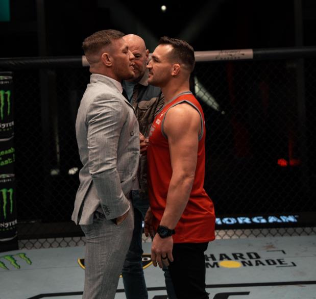 Conor McGregor slaps Michael Chandler on the face while filming TUF 31 as Dana White's teaser footage airs