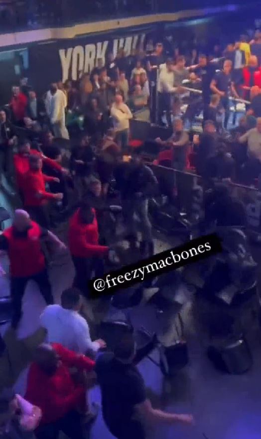 York Hall crowd descends in a frightening brawl after man is knocked down by a flying chair, with onlookers yelling