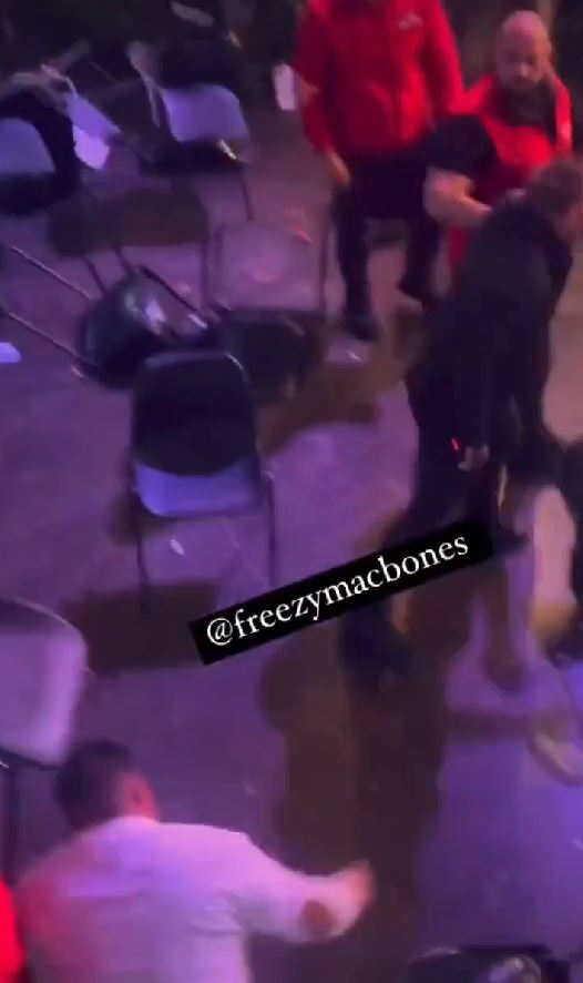 York Hall crowd descends in a frightening brawl after man is knocked down by a flying chair, with onlookers yelling