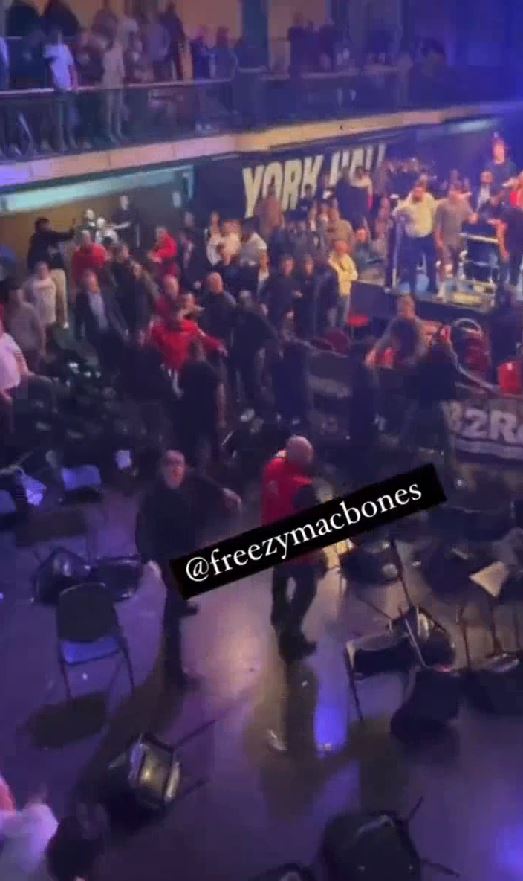 York Hall crowd descends in a frightening brawl after man is knocked down by a flying chair, with onlookers yelling