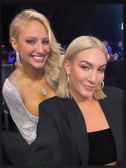 Ebanie bridges looks stunning in a low-cut dress while she fights with Conor McGregor.