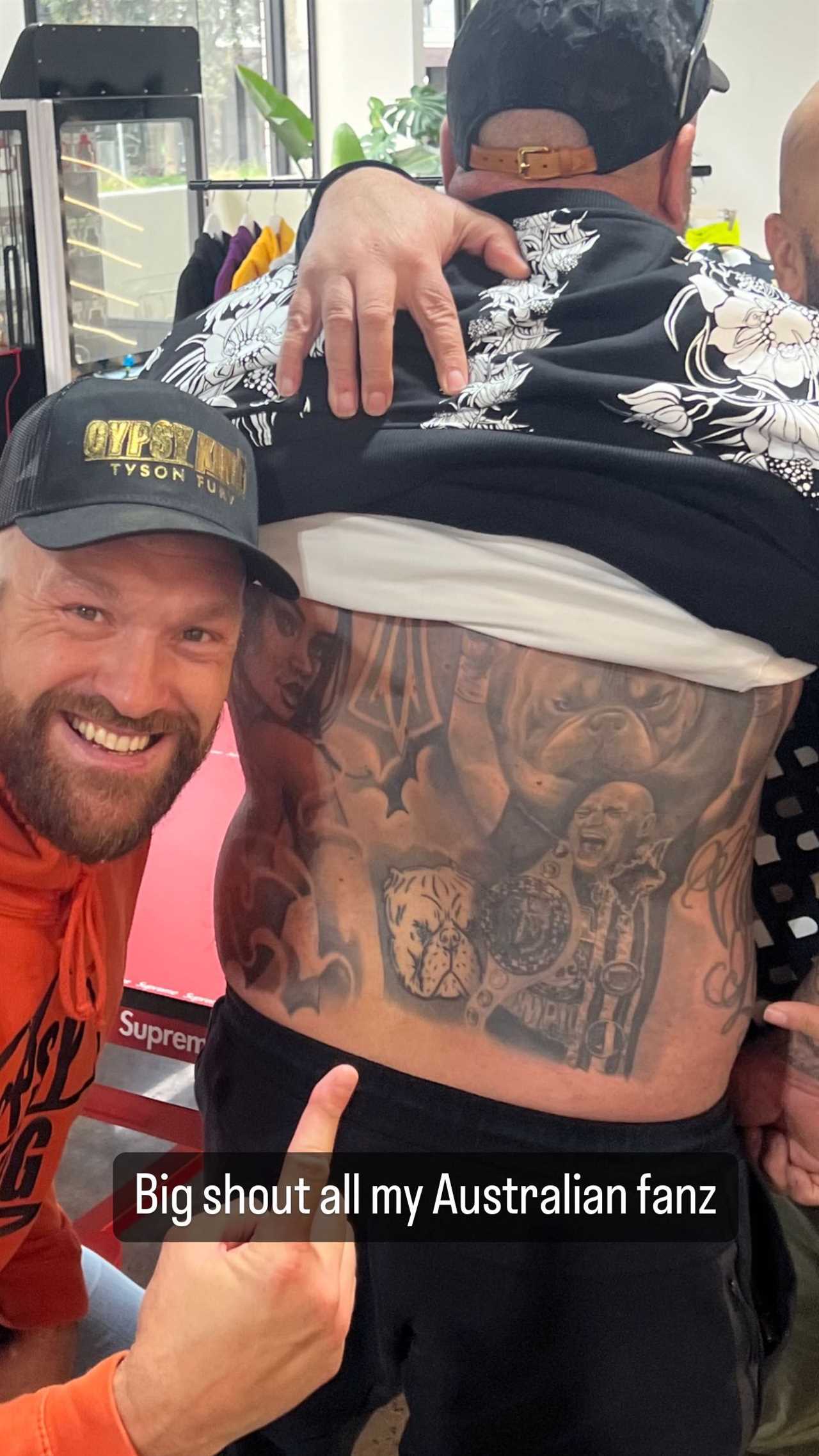 Tyson Fury is beaming as he meets a die-hard Gypsy King fan with a huge tattoo on his back
