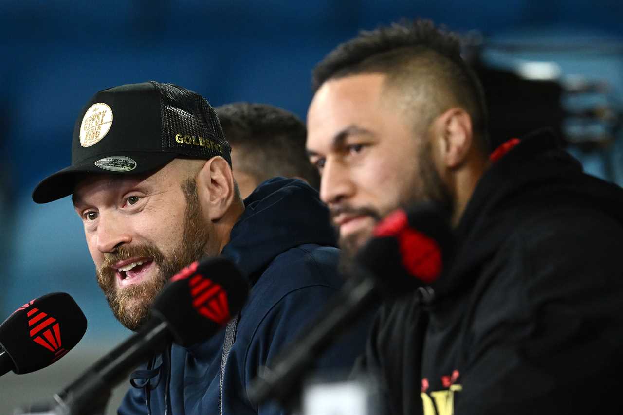Tyson Fury is beaming as he meets a die-hard Gypsy King fan with a huge tattoo on his back