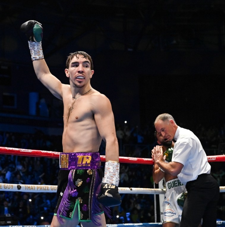 10 December 2022; Michael Conlan celebrates defeating Karim Guerfi in the first round of their featherweight bout at the SSE Arena in Belfast. Photo by Ramsey Cardy/Sportsfile
